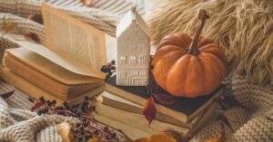 coZy autumn decor, books, and leaves on chunky knit textiles